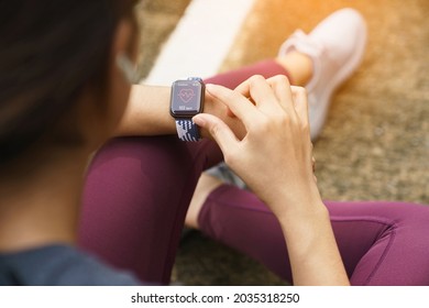 close-up sport women check on her smart watch - Shutterstock ID 2035318250