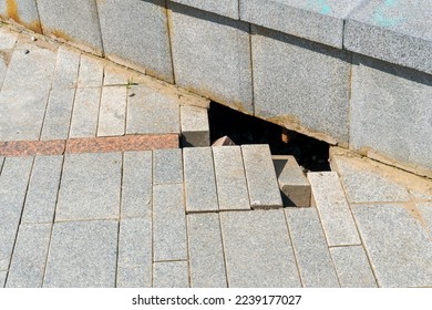 Close-up. Sports embankment in Vladivostok. Fallen off tiles on the promenade seaside promenade. - Powered by Shutterstock