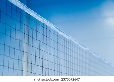 close-up sports equipment volleyball net on closed blue court competition matches details