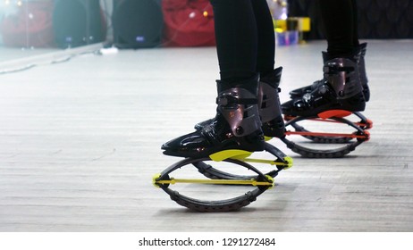 Closeup of sporty girl Kangoo jumps. Sports shoes.