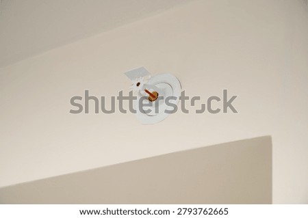 Close-up of sprinkler fire suppression system on the ceiling in the house, hotel or in the office. Automatic fire and emergency prevention.