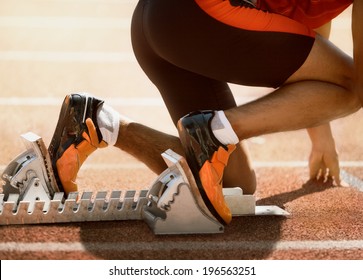 Close-up Of Sprinter Feet In Starting Block