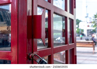 Close-up Of Square Tiles Windowed Door From Public Free Library With London Classic Red Phone Box At The City Sidewalk