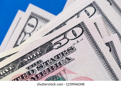 Close-up stack of fifty 50 dollars.
