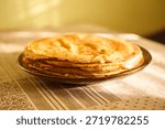 
A close-up of a stack of fried pancakes. Maslenitsa.