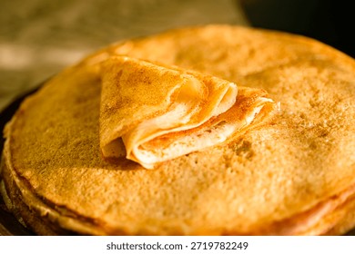 
A close-up of a stack of fried pancakes. Maslenitsa.