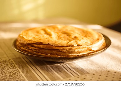 
A close-up of a stack of fried pancakes. Maslenitsa.
