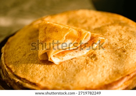 
A close-up of a stack of fried pancakes. Maslenitsa.