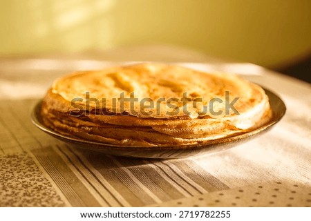 
A close-up of a stack of fried pancakes. Maslenitsa.
