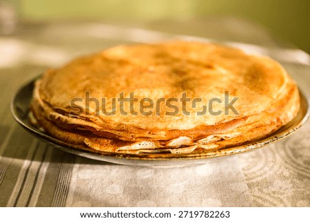 
A close-up of a stack of fried pancakes. Maslenitsa.