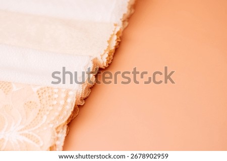Closeup stack of light lace fabrics, texture
