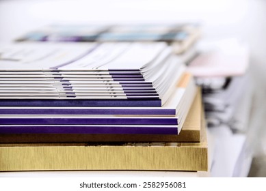 closeup of a stack of magazines in a bookstore or library.