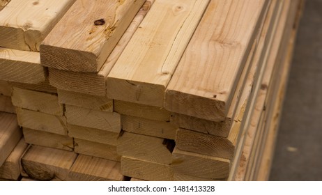 Closeup of a stack of pine planking ready to be used for construction