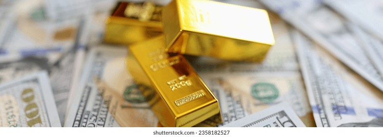 Close-up of stack small golden ingots on pots of money cash. Accumulation of wealth and self-insurance concept