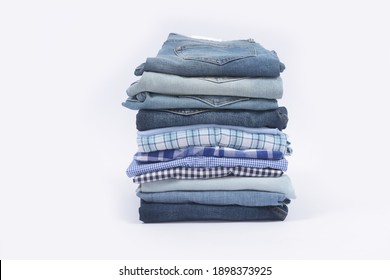 Closeup Stack of sweater, long sleeved blue , ,striped , lattice Shirt,jeans