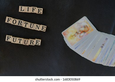 Close-up Stack Of Tarot Cards And Wooden Letters On Message For Communication About What People Want To Know Forecasts From Tarot Cards Predictions, Divine Magic Concept