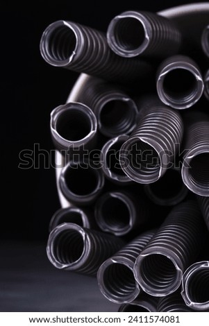 Closeup of Stacked Corrugated Flexible Conduit Electrical PVC Wiring Pipe