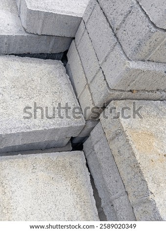 Similar – Image, Stock Photo Stack of gray concrete paving stones