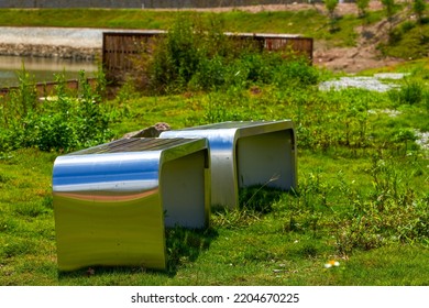 Close-up Of Stainless Steel Metal Bench In Outdoor Park