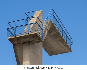 Closeup Of Stairs And Railing Leading To A High Dive Board At A Swimming Pool