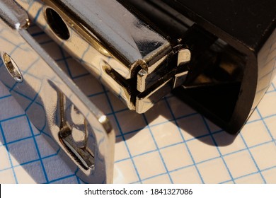 
close-up of a stapler on note pad