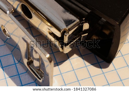 
close-up of a stapler on note pad