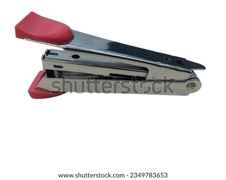 Close-Up Of Stapler Red Color With White Background