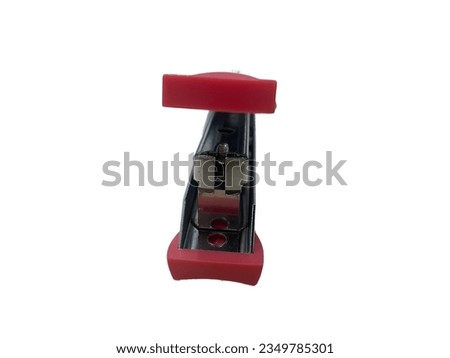 Close-Up Of Stapler Red Color With White Background