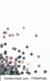 Closeup Of Star Confetti On A White Background