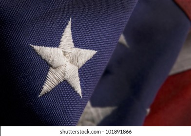Closeup Of A Star Stitched On An America Flag