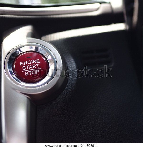 Closeup start button\
red color for start and stop engine in the car,Black and silver\
color interior smart\
car
