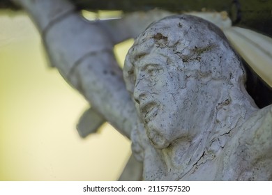 A closeup of the statue of Jesus in a road chapel - Shutterstock ID 2115757520