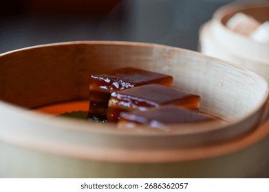 Close-up of stemed red dates cake, red date pudding. Chinese sweet and desserts.Traditional and common food in Yam Cha Culture. Chinese culture and Chinese cuisine. Food and beverage concept.