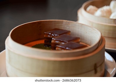 Close-up of stemed red dates cake, red date pudding. Chinese sweet and desserts.Traditional and common food in Yam Cha Culture. Chinese culture and Chinese cuisine. Food and beverage concept.