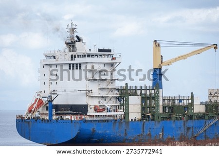 Close-up of the stern section and superstructure of a container ship at sea