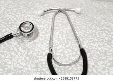 Close-up of a Stethoscope on Light Grey Fabric