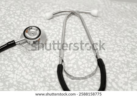 Close-up of a Stethoscope on Light Grey Fabric