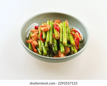 Close-up of Stir-fried Garlic Shrimp with garlic shoots, dried shrimp and red pepper on a dish, South Korea
