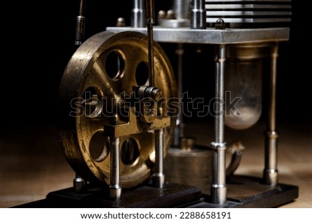 closeup of a stirling engine construction with real shadows and black background