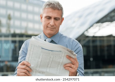 Closeup Of A Stockbroker Reading Stock Price