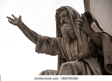 Closeup of stone statue of a dramatic man with a beard stretching his arm in Italy, rome, Piazza navona fountain square. White background.