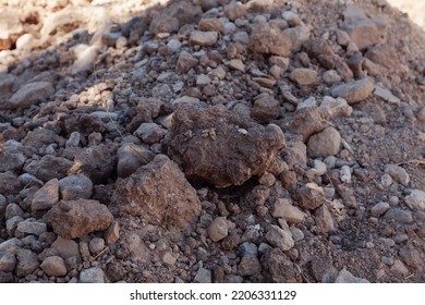 Close-up Of Stony Soil. Ground Texture Stone And Earth.