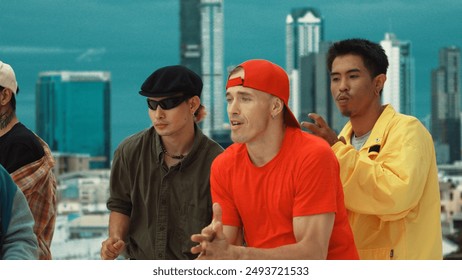 Closeup of street dancer wear colorful outfit while dance together. Group of attractive hipster dance and move to hip-hop music at skyscraper and city view. Break dance. Outdoor sport 2024. Hiphop. - Powered by Shutterstock
