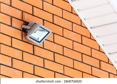 close-up of a street rectangular lamp on a brick wall