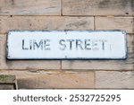 Close-up of a street sign for Lime Street in the city of Liverpool, UK.
