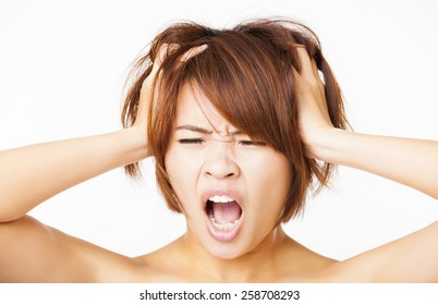 Closeup Stressed Young Woman Pulling  Hair Out And Yelling Screaming