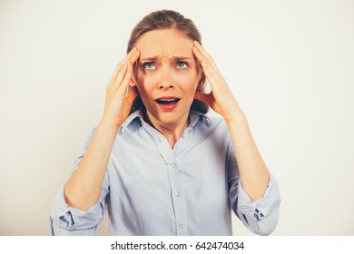 Closeup Of Stressed Young Woman Rolling Eyes