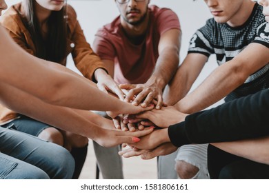 Close-up Of Students Holding All Hands Together