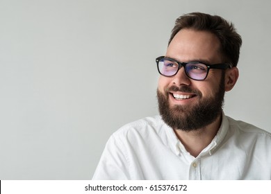 Closeup Studio Portrait Of Man With Beard Looking Away From Camera