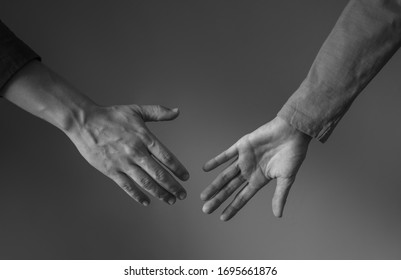 Closeup Studio Shot Of Man And Woman's Hands Coming Together. People Love And Relationship Concept. 